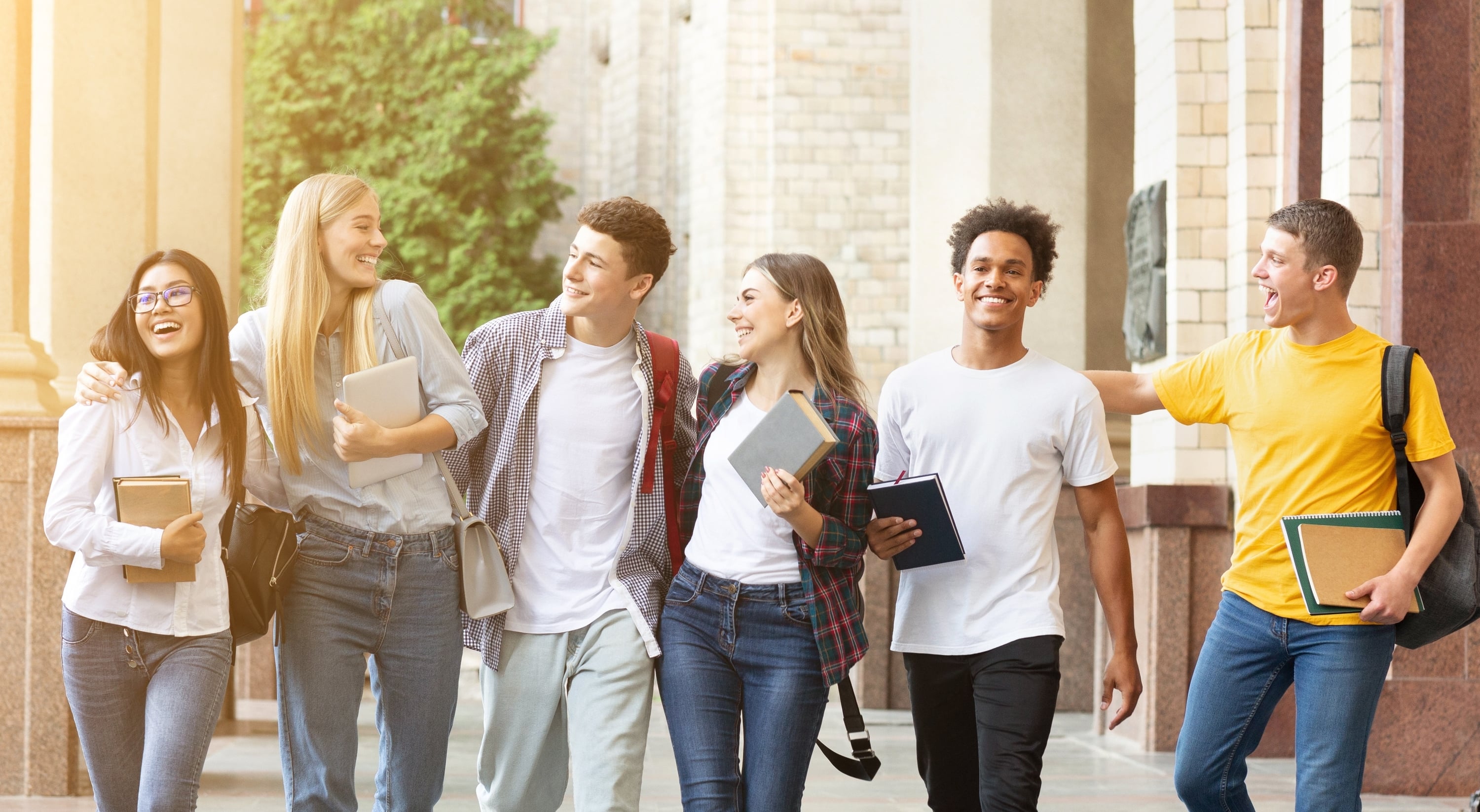 Diverse students walking together in campus